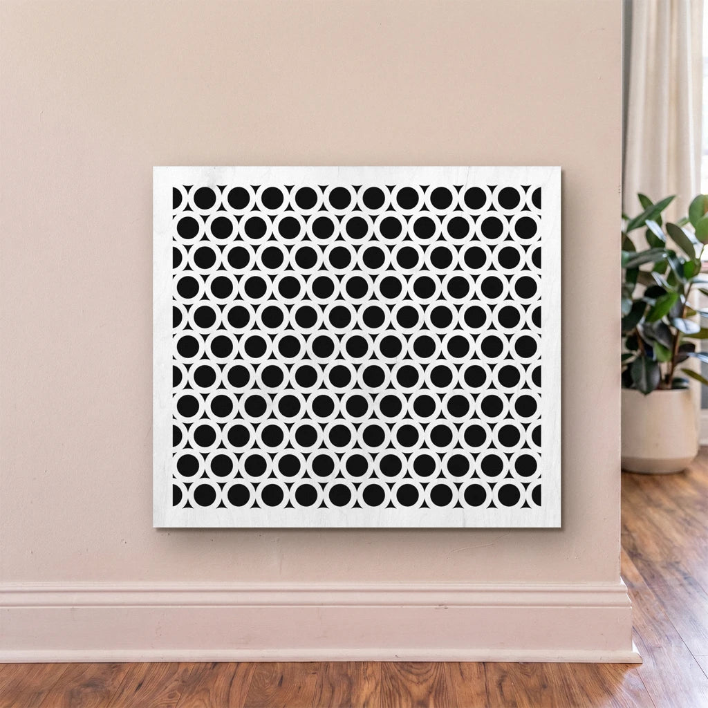 Decorative wall panel with geometric pattern on a beige wall.