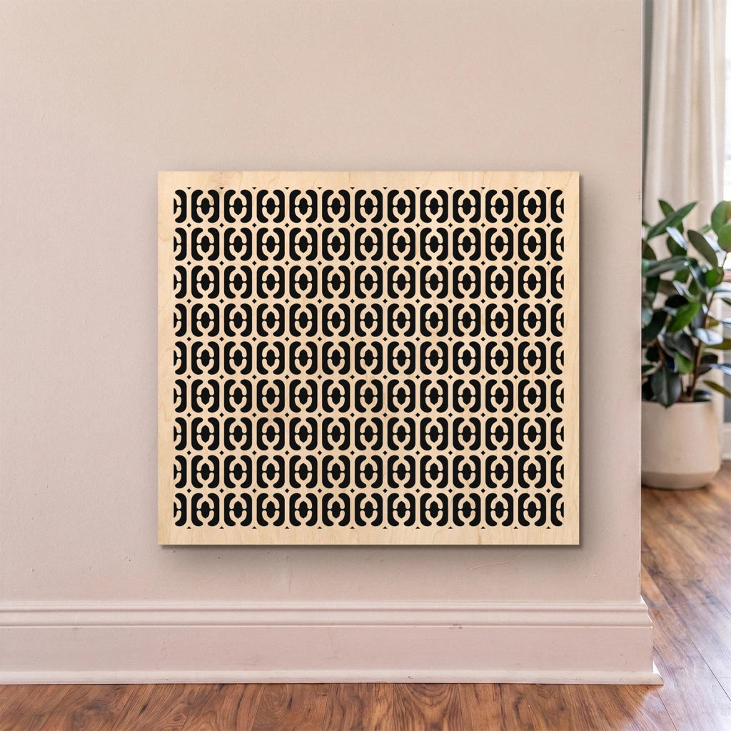 Decorative wall art with a geometric pattern on a beige wall.