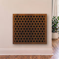Decorative wooden panel with geometric pattern on a wall