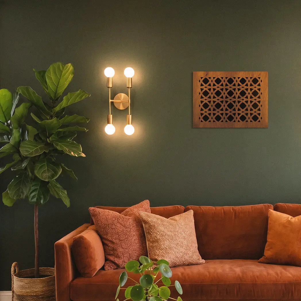 Cozy living room with a brown sofa, decorative pillows, and wall sconces.
