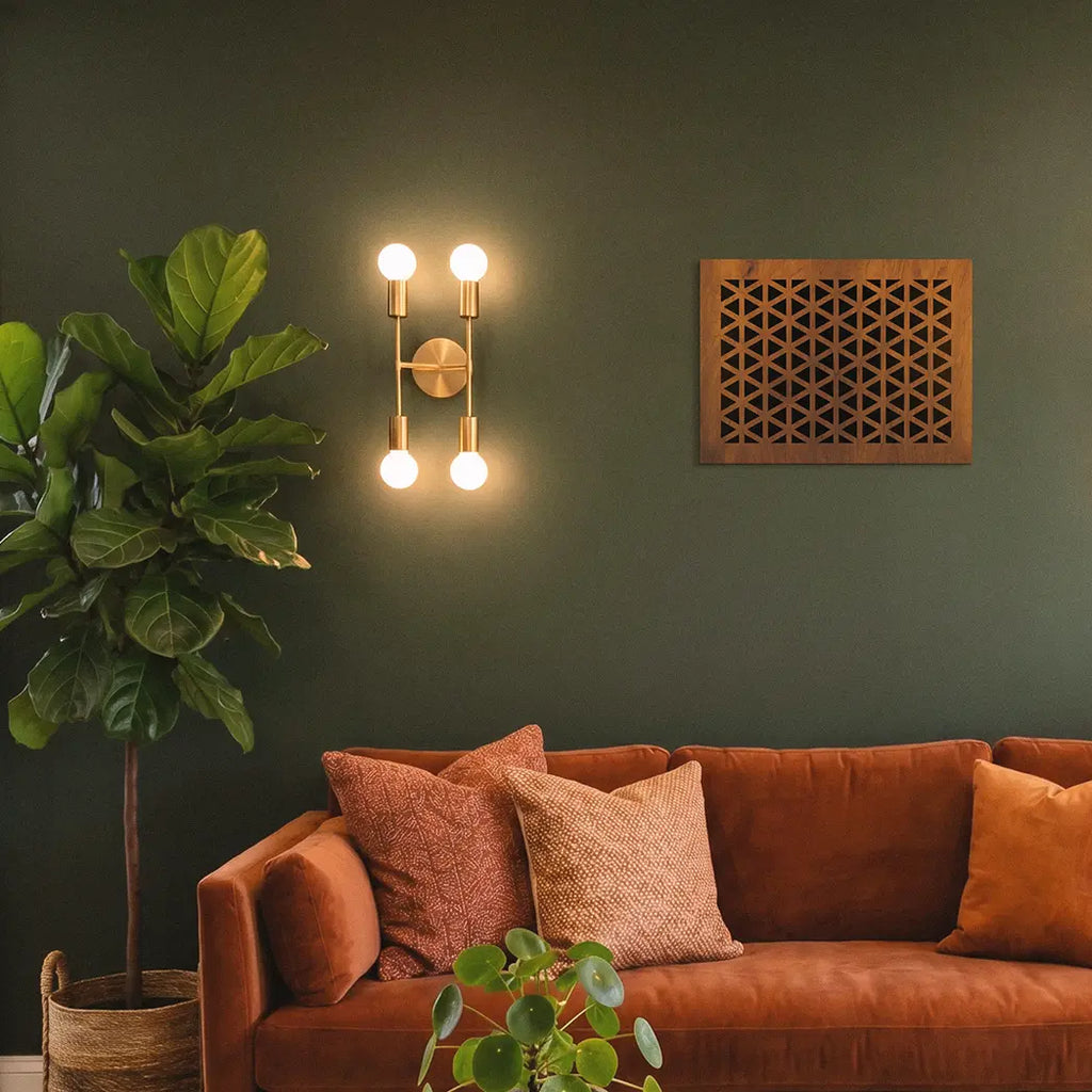 Living room with a brown sofa, decorative pillows, and wall sconces.